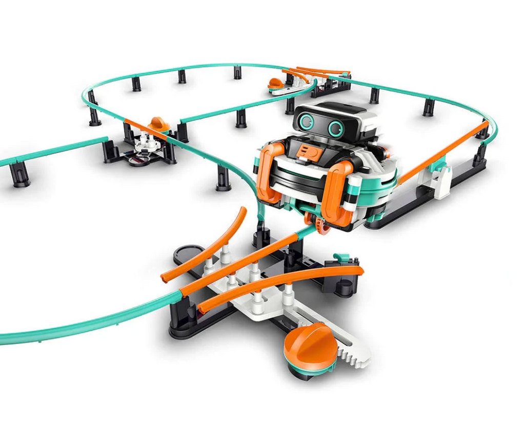 A track with orange and green pieces to make a rough figure 8 monorail system and the robot riding along the track. 