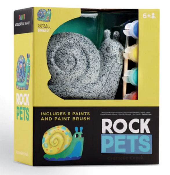 Yellow box with clear plastic window showing the pet rock snail along with the paintys used to decorate it.