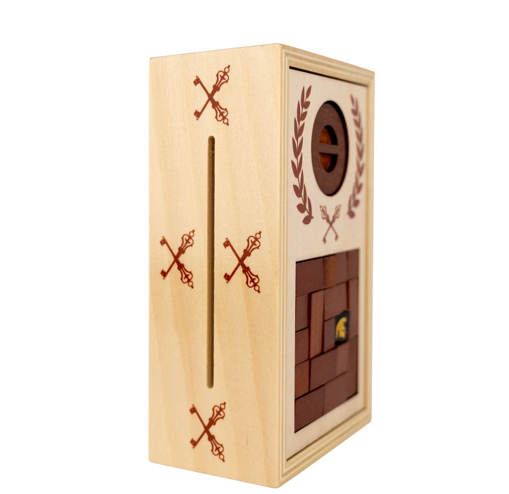 The Roman Lock Box a wooden puzzle box with decorative patterns on the sides and front pictured here from the side. 