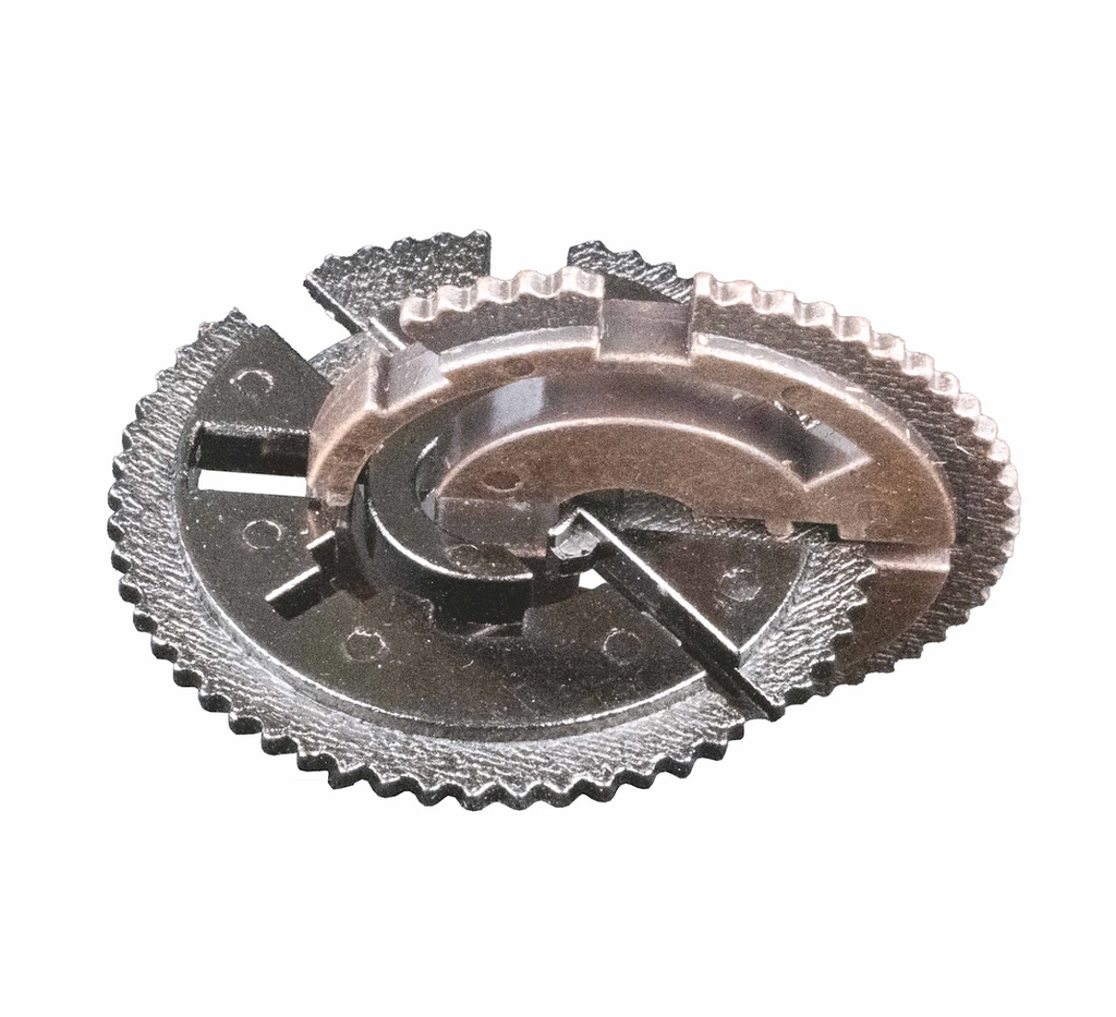Close-up of a mechanical metal gear puzzle. 