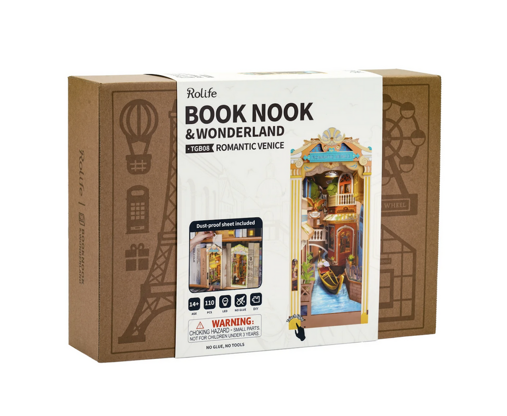 Kraft box packaged with a white sleeve that has color pictures of the miniature Book Nook fully assembled and depicting a scene from Venice, Italy. 