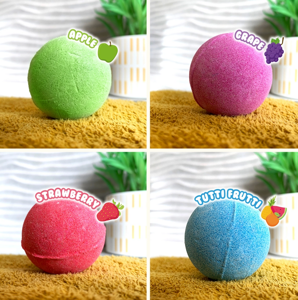 Each of the scents of the Round Baff Bombz. Green, apple scented. Purple, grape scented. Red, strawberry scented. Blue, tutti frutti scented. 