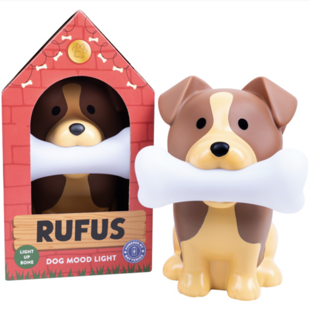 Rufus the Dog Mood Light packaged in a dog house shaped box with Rufus the Dog in a sitting position holding a bone in his mouth. 