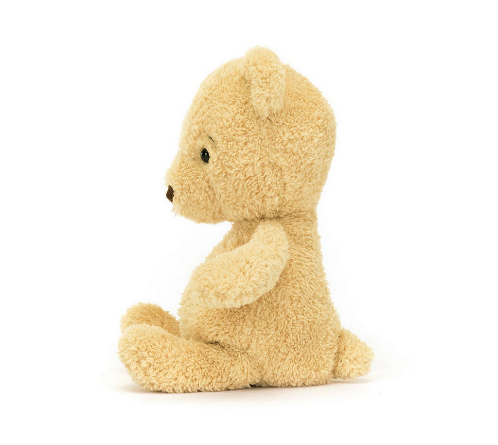 Side view of Rumblikin Beaar stuffed animal. 