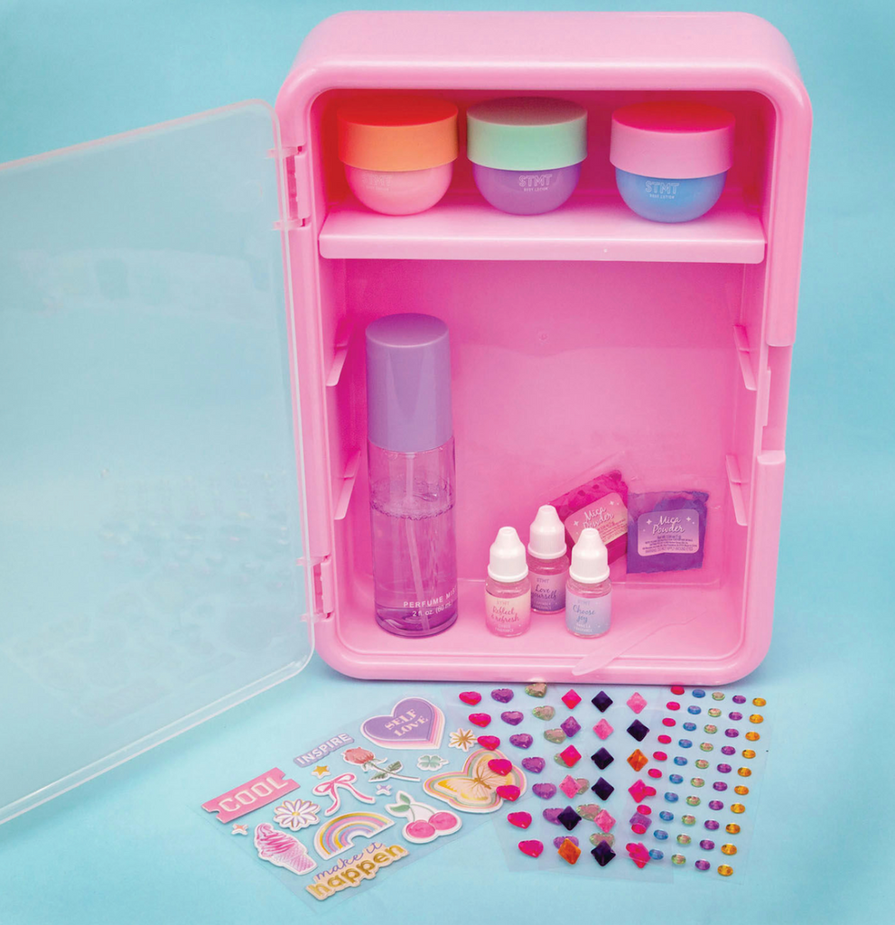 The STMT Signature Scent Boutique locker container that holds the lotion pots, body spray bottle, glitter powder, scent add ins and stickers that are all included in the kit. 