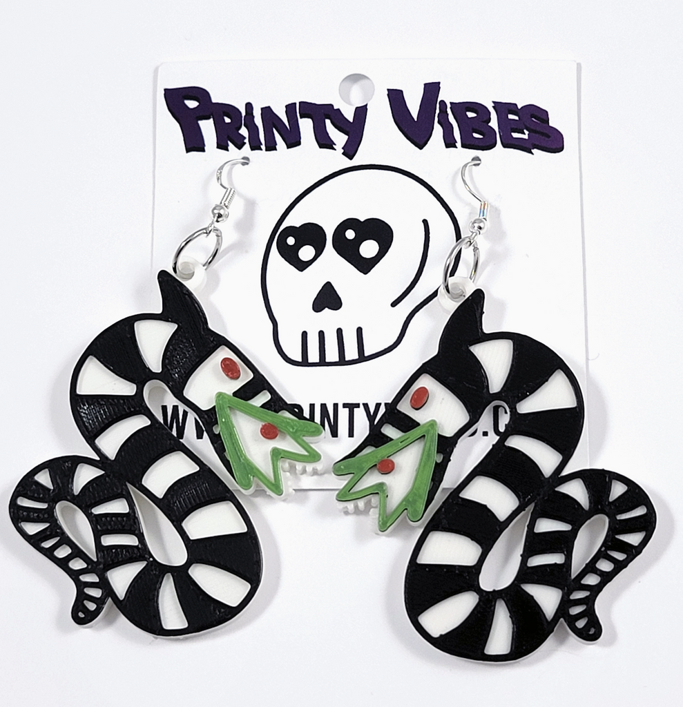 3D printed Sandworm earrings displayed on a hang card with the Printy Vibes logo. 
