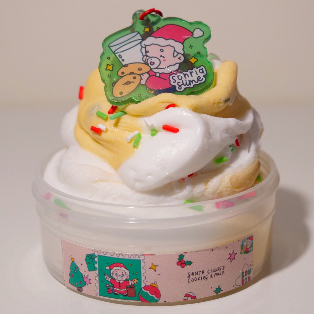 Two tone colored Santa Claus's Cookies and Milk slime with the included key chain that features an illustration of Santa enjoying some cookies and milk. (Not food)