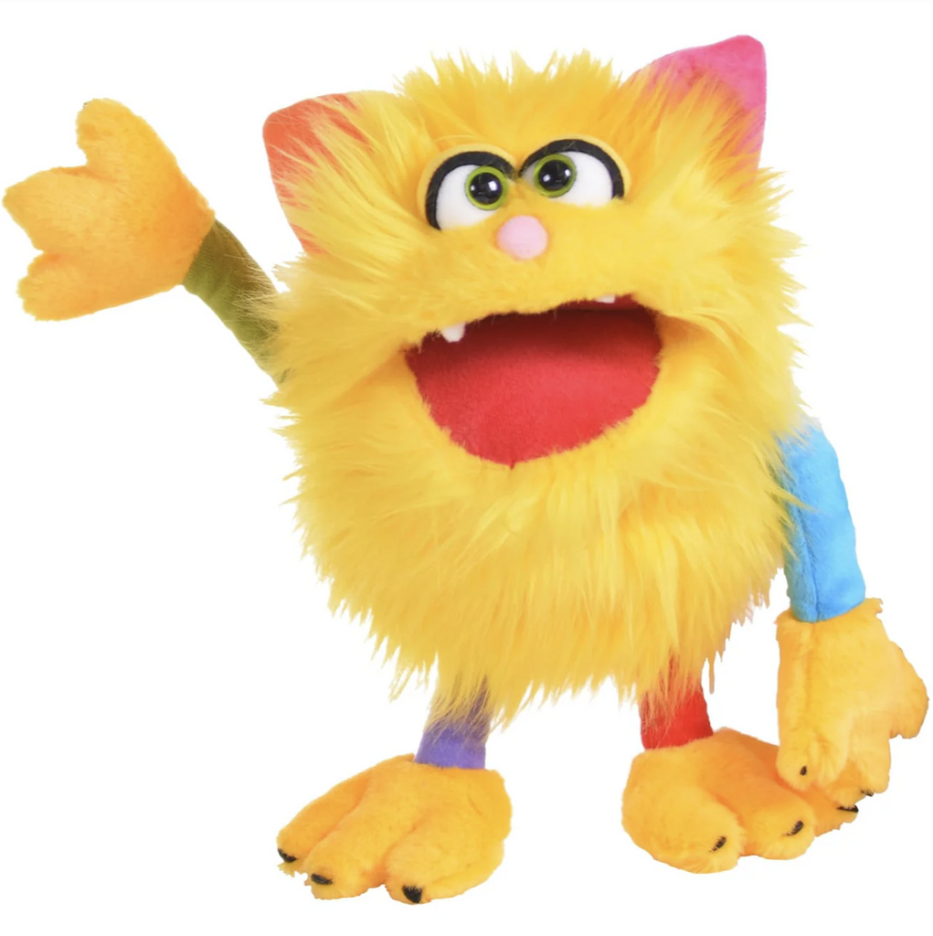 Plush hand puppet named Sassy with fuzzy yellow hair, multicolored arms and legs, as well as green eyes, and one orange and one pink ear. 