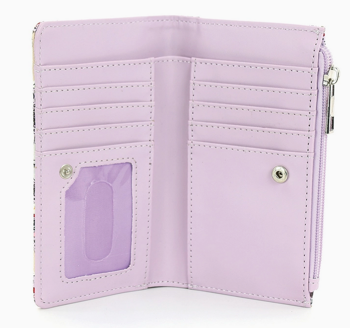 The bunnies wallet opened to show the clear id window and card slots on either side. The inside is a solid light purple. 