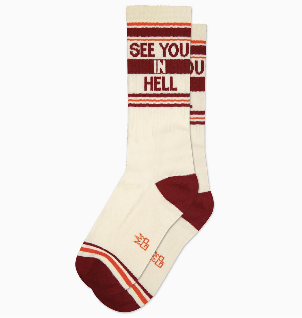 White tube socks with brown and orange stripes that read "See You In Hell"