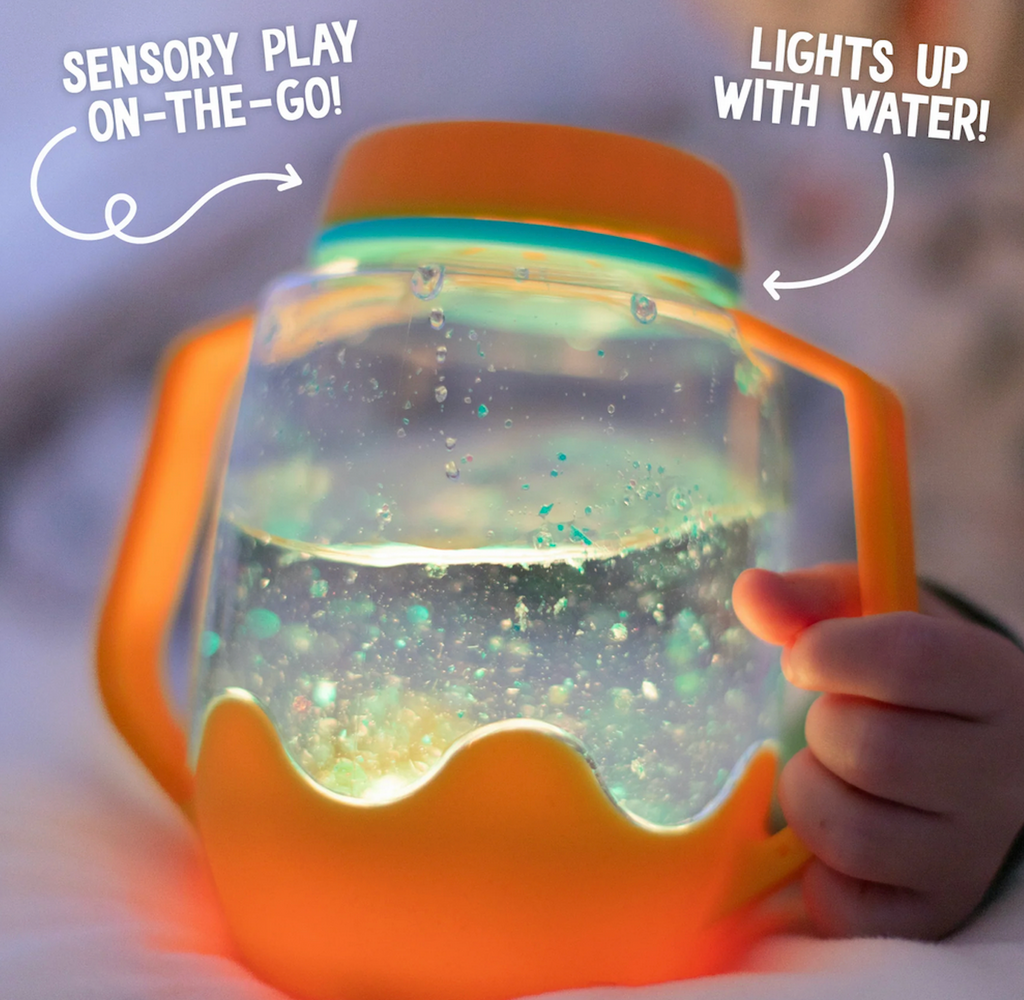 Orange Sensory Play Jar filled with warer and blue gel with a clear light shining in it. 