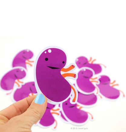 Close up of purple kidney shaped sticker. 