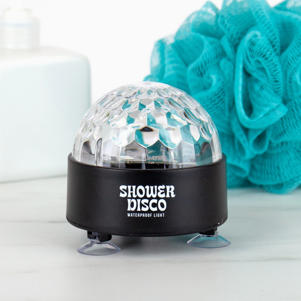 Shower disco light with 'Shower Disco' branding on a white surface with a blue sponge in the background.