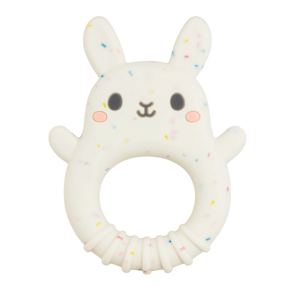 Close up view of the Silicone Bunny Teether. It is white with multicolored flecks throughout and bright, pink cheeks. 