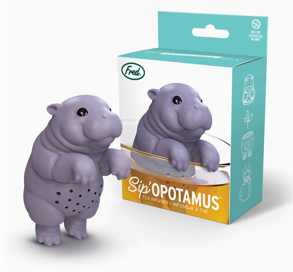 Grey hippo-shaped tea infuser with packaging on a white background