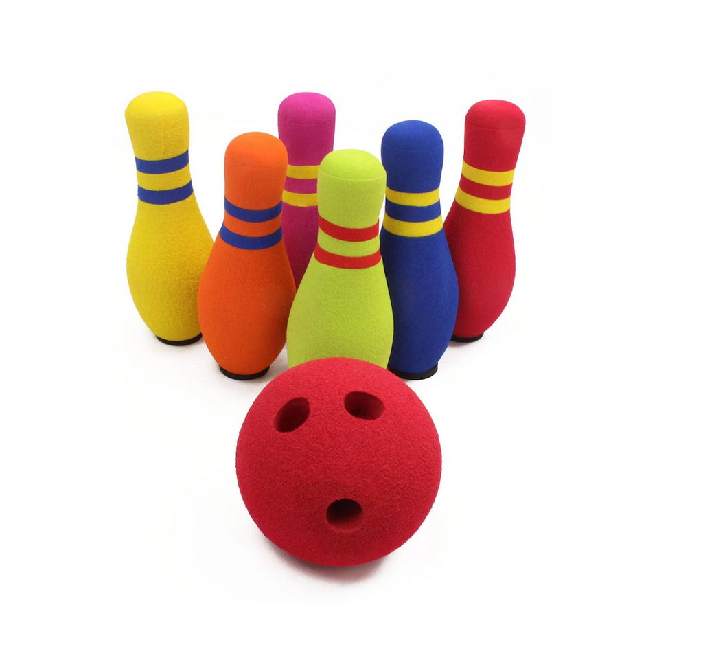 Brightly colored foam bowling pins lined up with a red, weighted foam ball. 