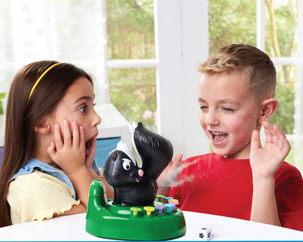 Two children playing the Skunked! game.