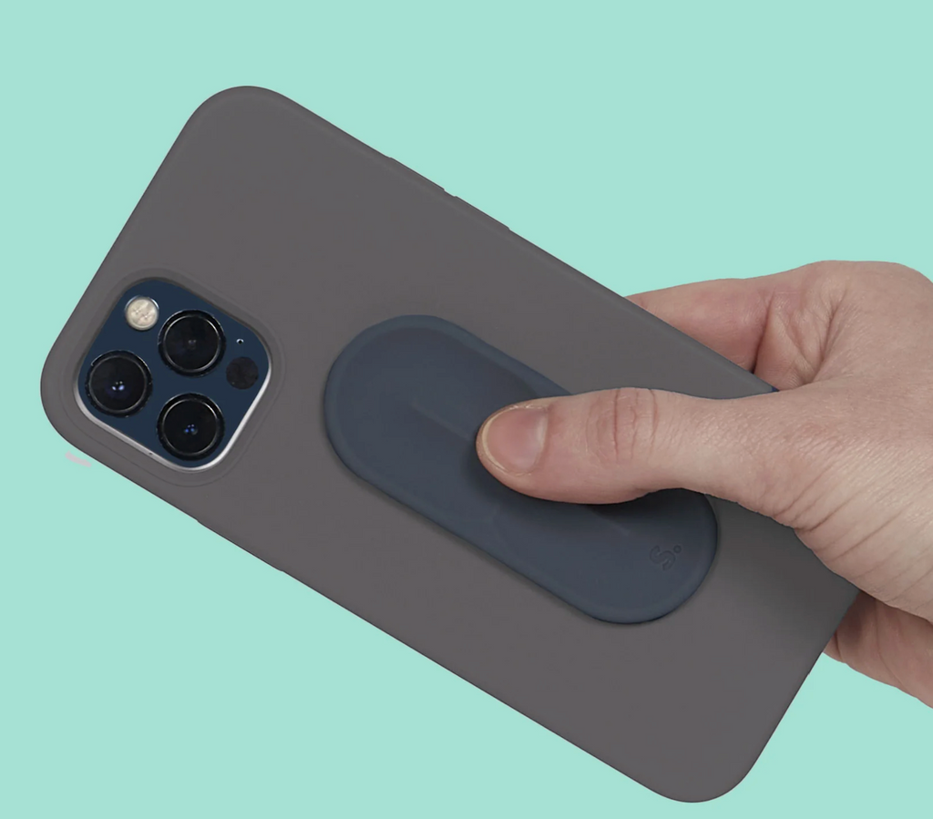 Close up picture of the Slabs Path Oval Sensory Sticker attached to the back of a smart phone. 