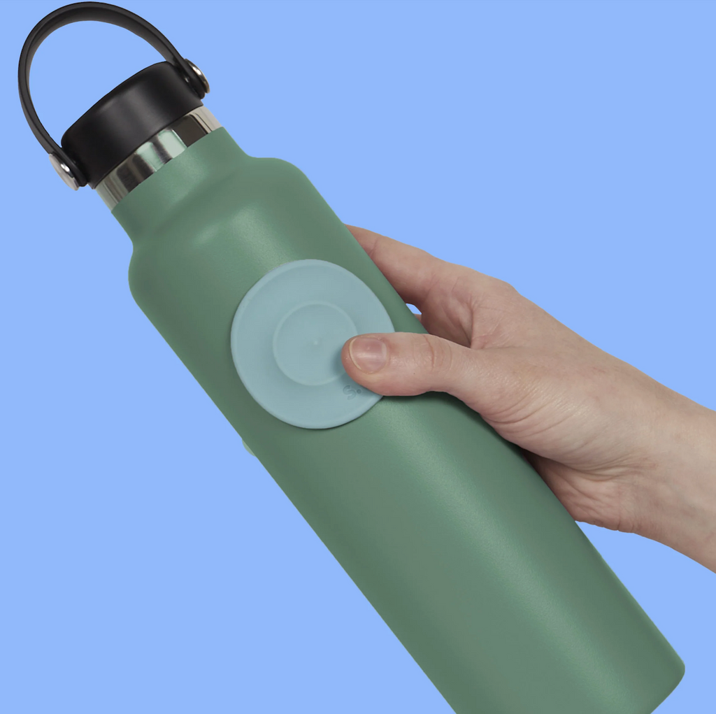 Green water bottle with a Path Round Slabs Sensory Sticker attached. 