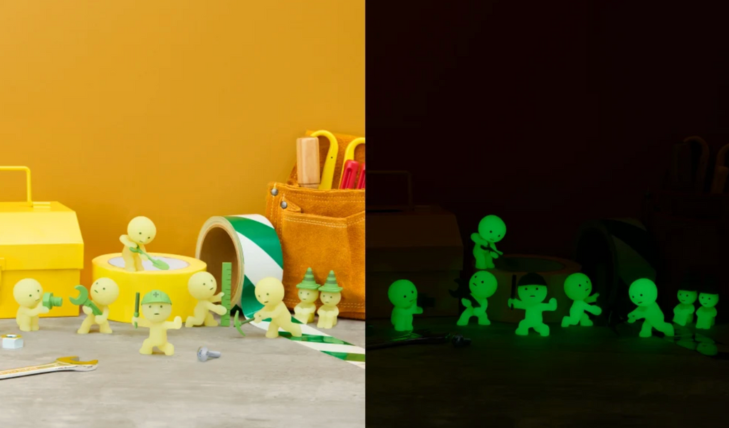 Smiski Construction series green in the day light and glowing green in the dark.