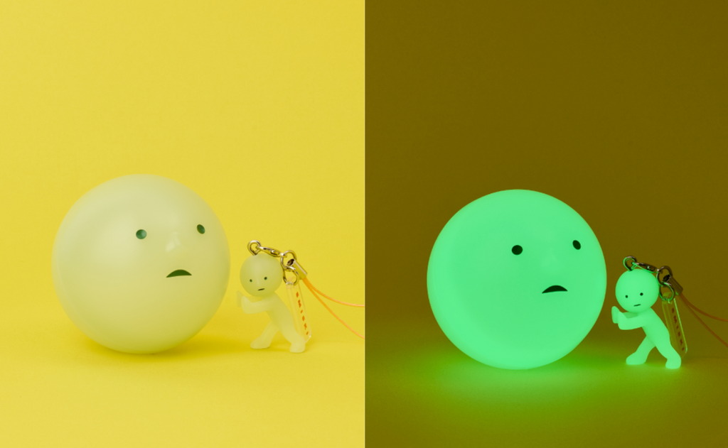 Smiski strap series 2 capsule and figure side by side.