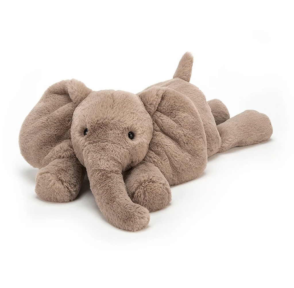 Stuffed animal large Smudge Elephant laying flat on it's tummy. 