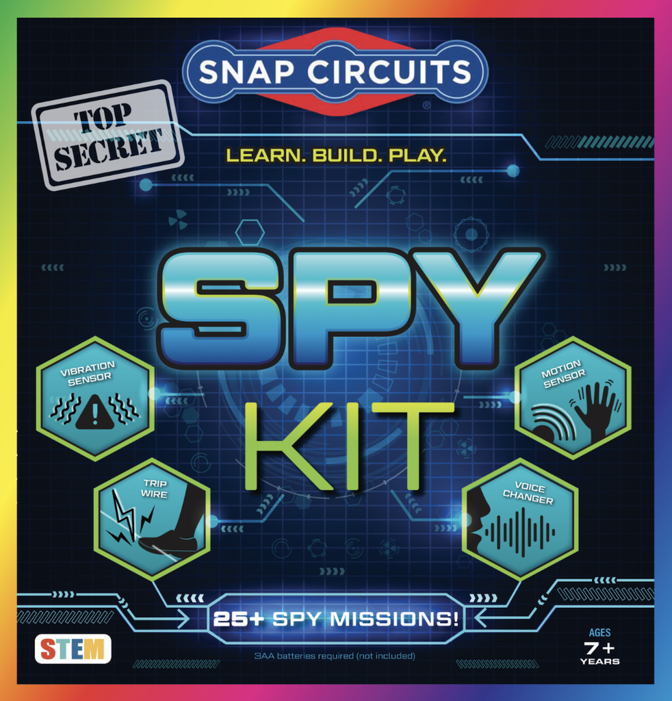 Snap Circuits Spy Kit box with colorful lettering and illustrations depicting a few of the included activities, such as building a motion sensor, voice changer, trip wire and vibration sensor. 