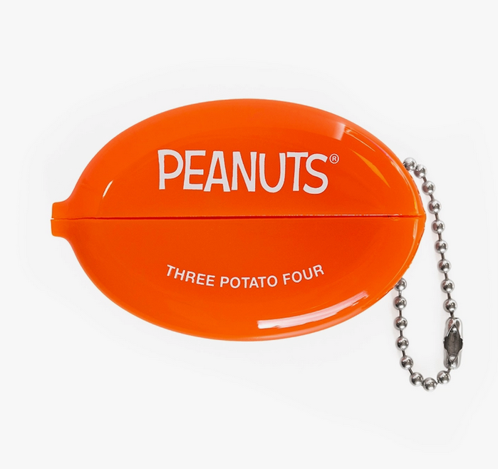 Orange coin purse with "Peanuts" printed on the opening side. 