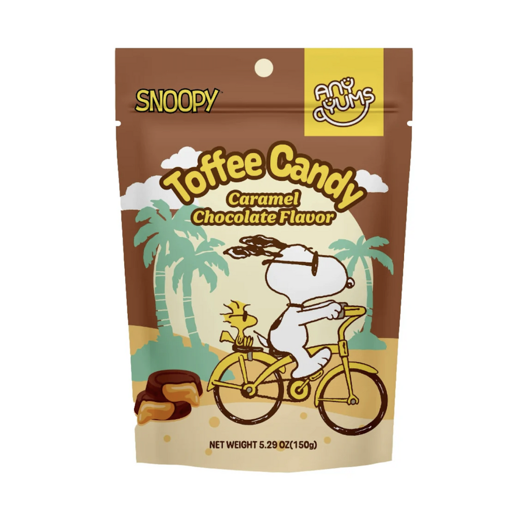 A bag of Snoopy Toffee Candy with Snoopy and Woostock riding a bicycle together on the front of the bag. 