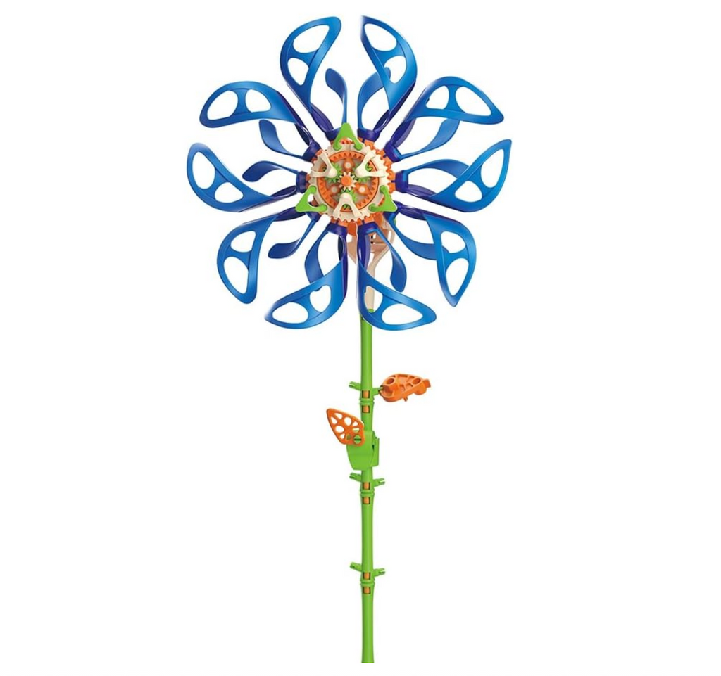 Kinetic flower sculpture with blue petals and green stem. A solar panel makes it spin with sunlight. 