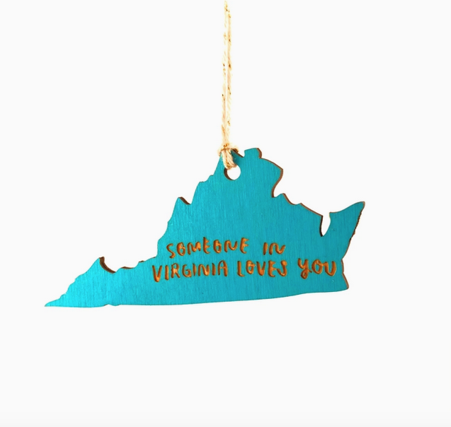 Laser cut turquoise wood ornament in the shape of the state of Virginia that reads "Someone in Virginia Loves You"