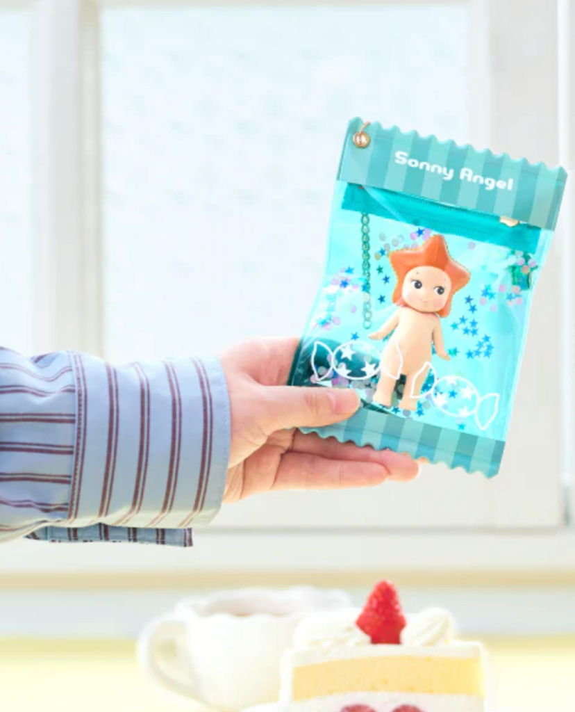 A blue Sonny Angel Sweet Candy Bestie Case with an adorable Sonny Angel figure inside. 