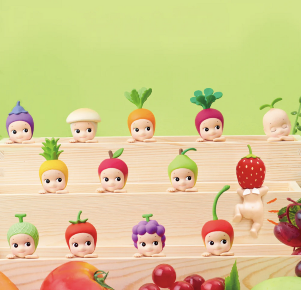 Sonny Angel Harvest Hippers on wooden shelves with a green background.