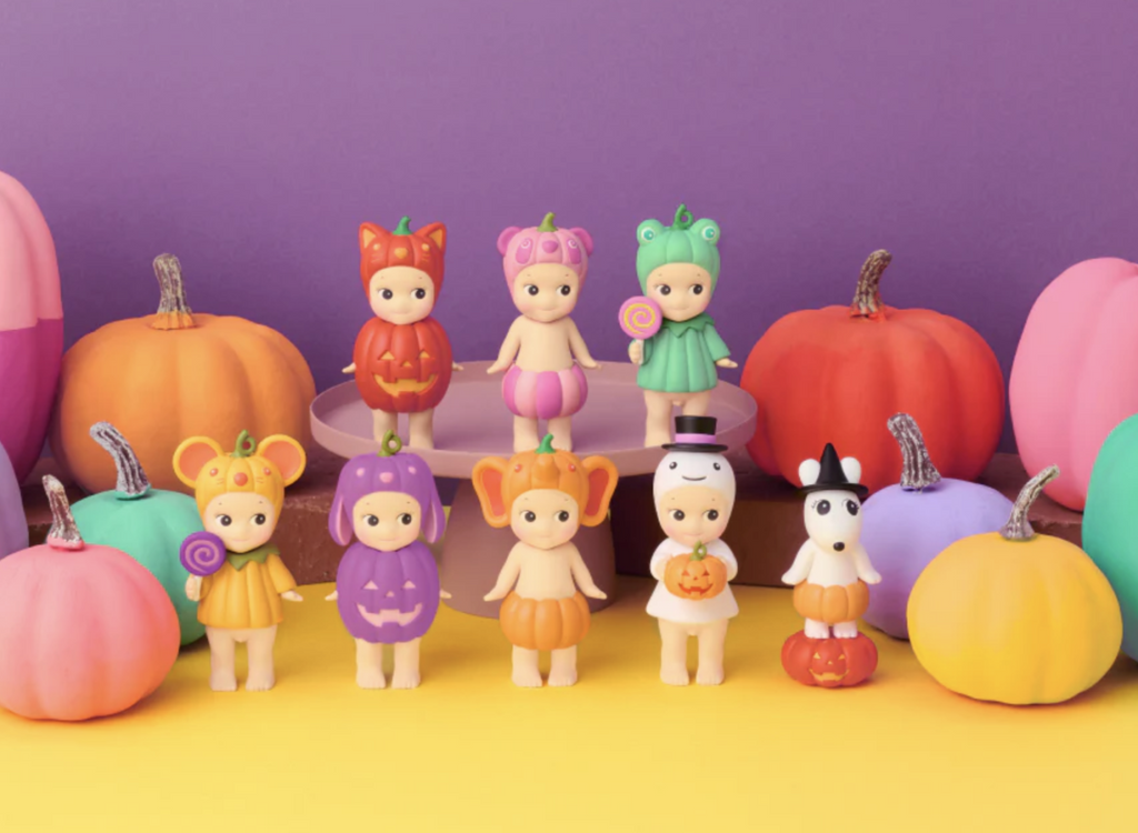 Set of 8 Sonny Angel collectible figures dressed as animals in pumpkin costumes. 