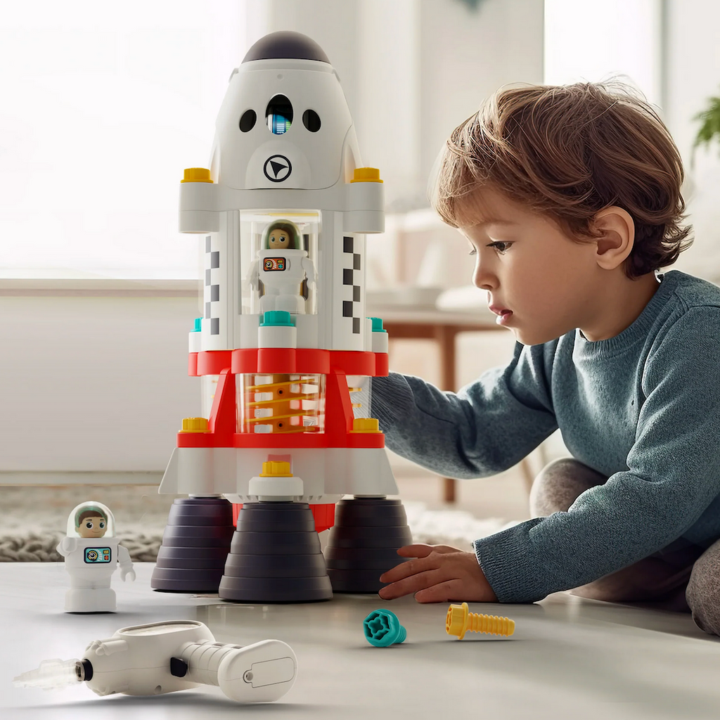 A young kid playing with the Space Adventure Rocket Set. 