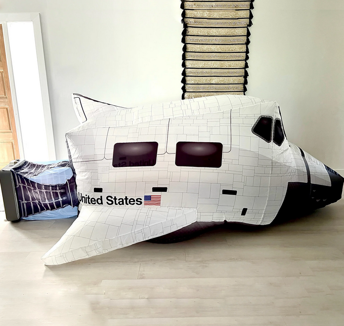 Space Shuttle Airfort inflated in a living room. 