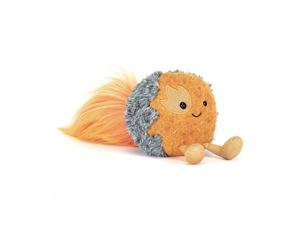 Plush orange and grey space comet with a smiling face on a white background.