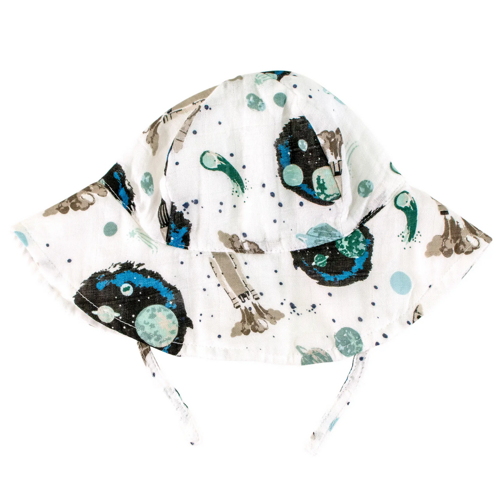 Muslin sun hat with chin strap and wide brim with a pattern of planets and spaceships.