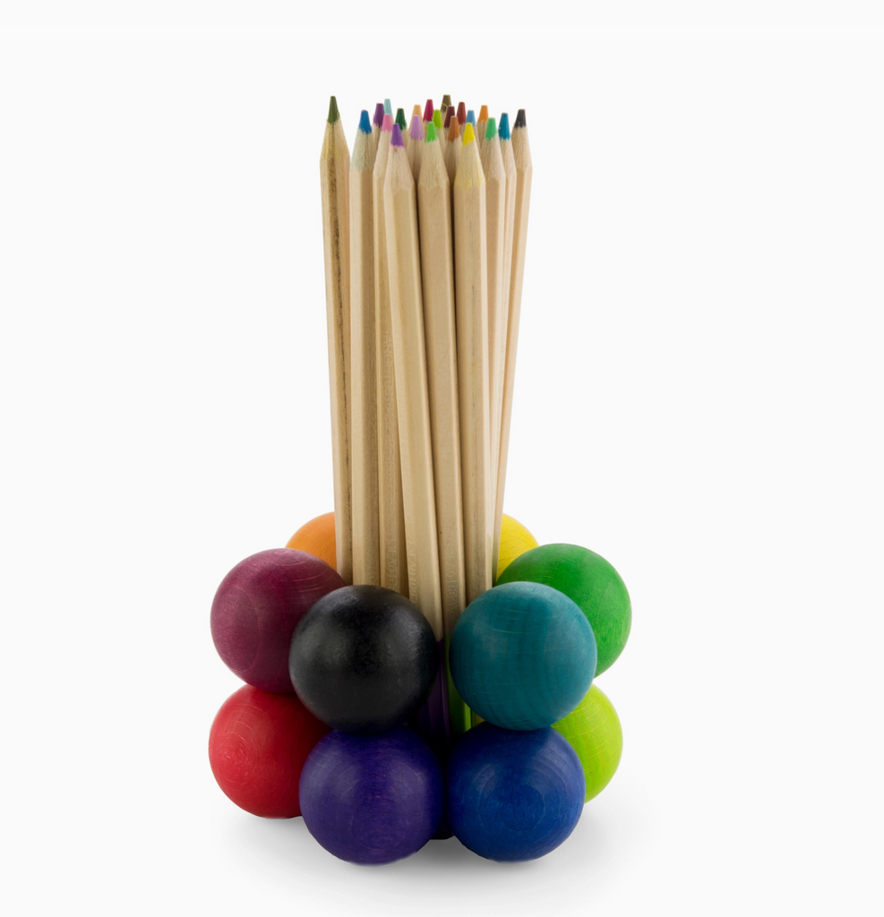 Spectrum 12 playable art ball arragned as a pen holder with a collection of colored pencils inside.