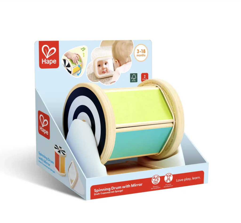The Spinning Drum with Mirror packaged in an open box that allows the drum to spin in its base and show the different patterns and colors. 