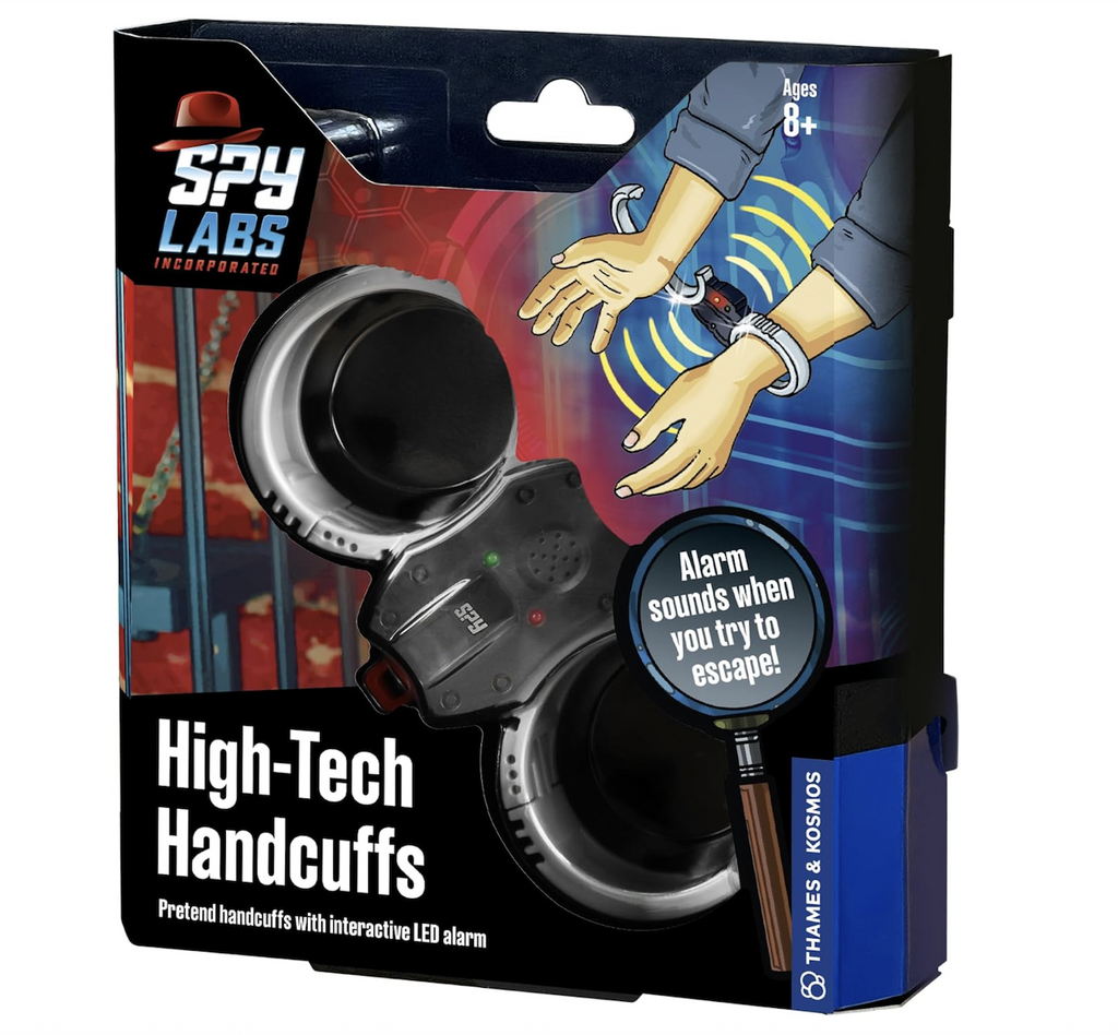 Spy Labs High-Tech Handcuffs packaged in an illustrated box showing the handcuffs closing on someones wrists with an open portion that shows the toy handcuffs in the box. 