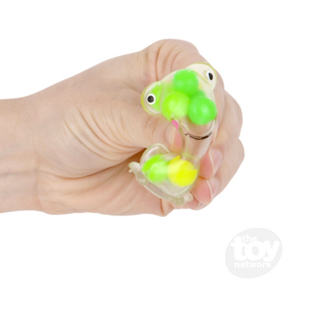 A hand squeezing the Squeezy Bead Frog. 
