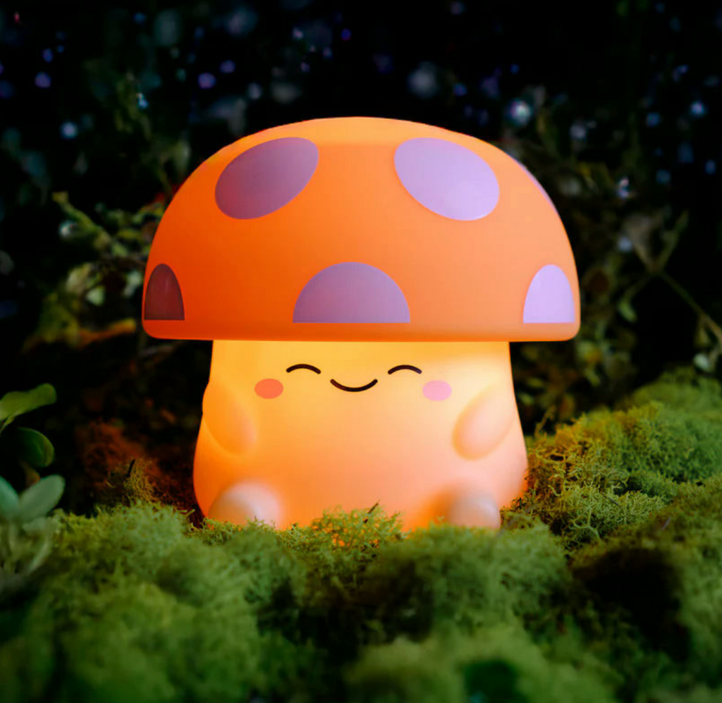 Mushi Mushroom Squishy Light with orange mushroom top with white polka dots on a tan base with cute smiling face. 