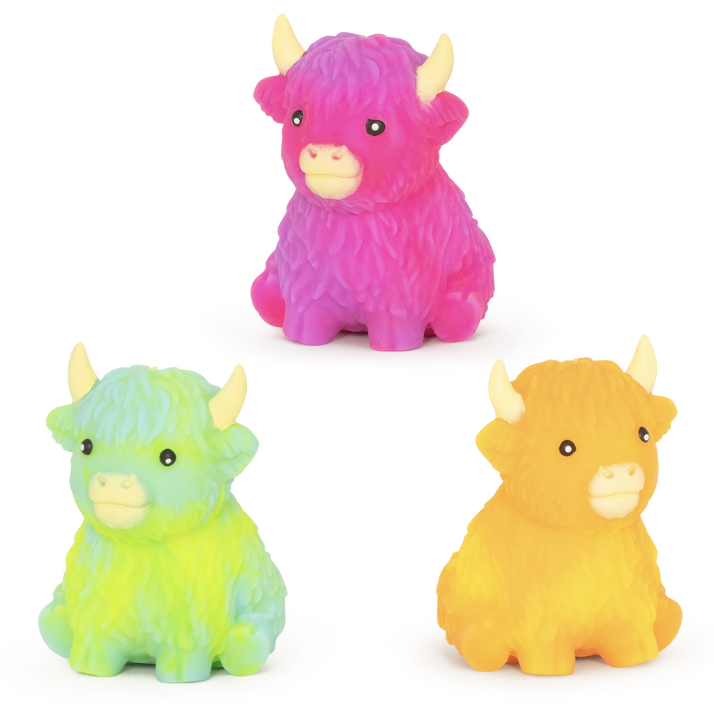 Three Squishy Rainbow Highland Cows in pink, yellow and blue green. 