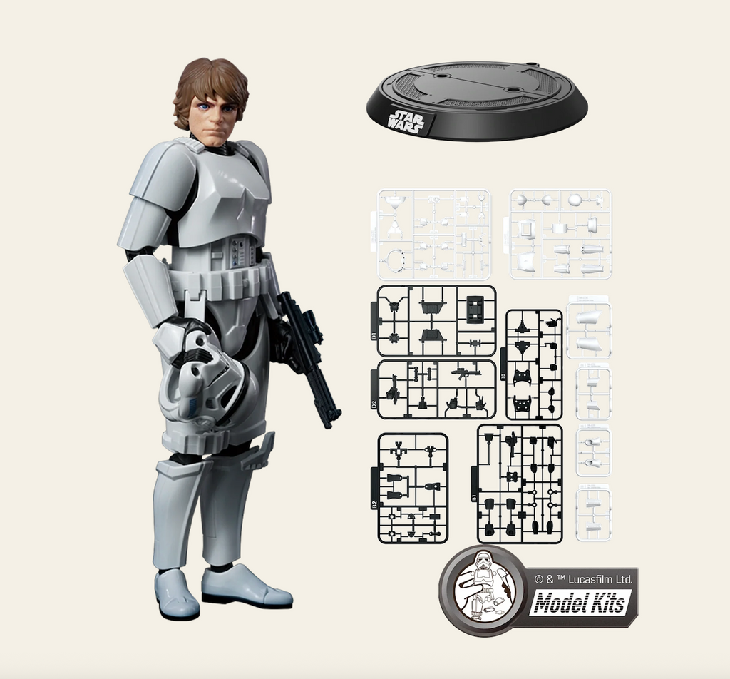 Luke Skywalker Star Wars A New Hope model kit pictured with the pieces in their frames and the display stand. 
