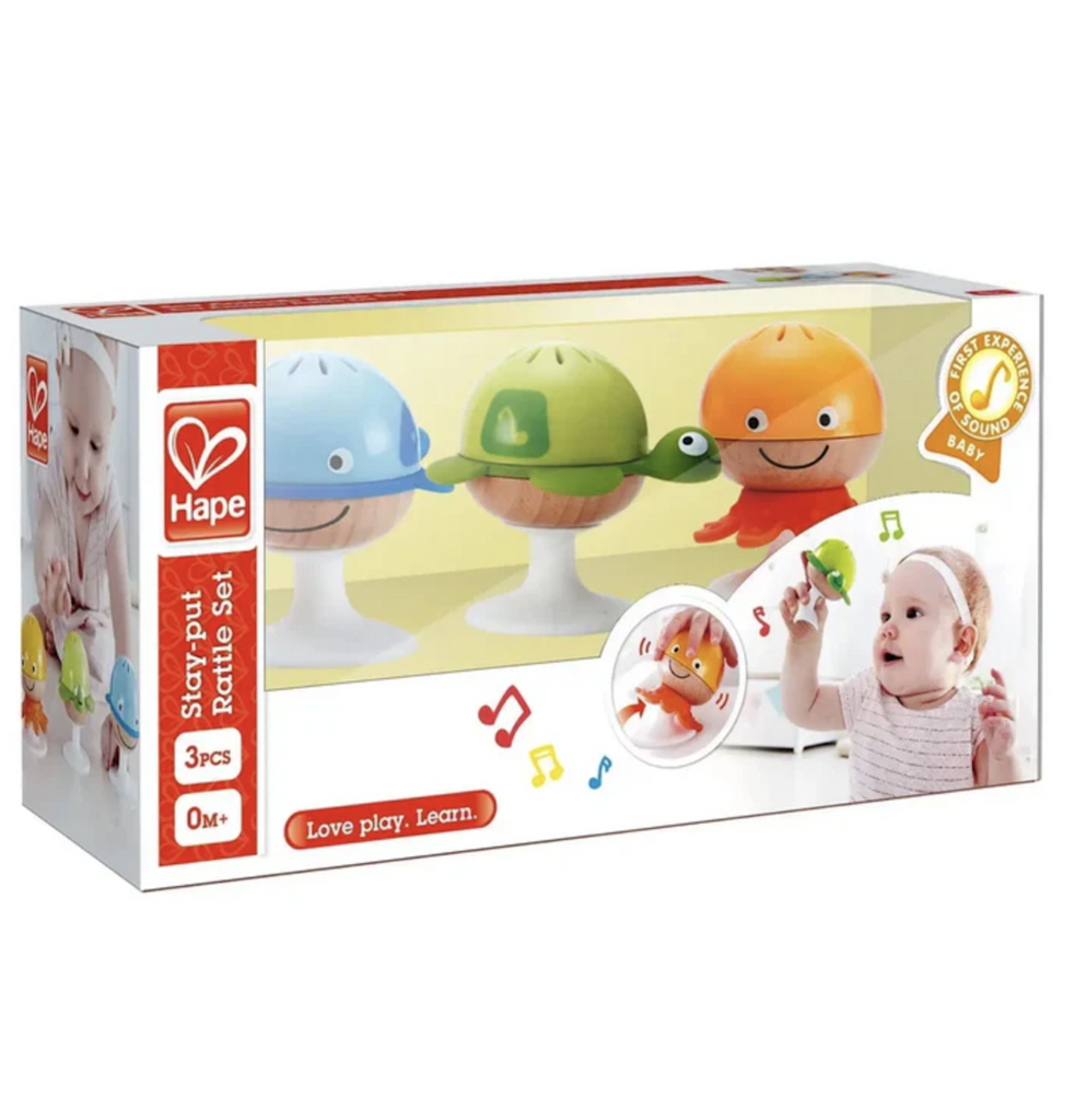Set of three sea creature themed rattles packaged in an open box that clearly shows the bright colors of the turtle, octopus and whale rattles with suction cup bases that will secure them to many surfaces. 