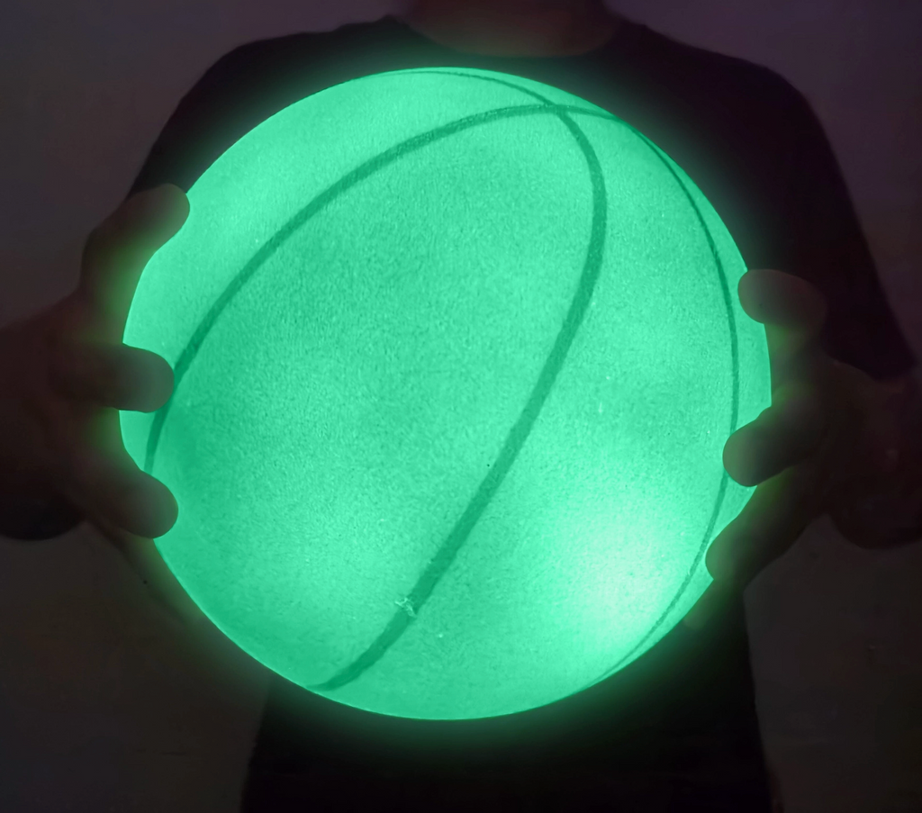 StealthDunk Silent Basketball glowing bright green. 