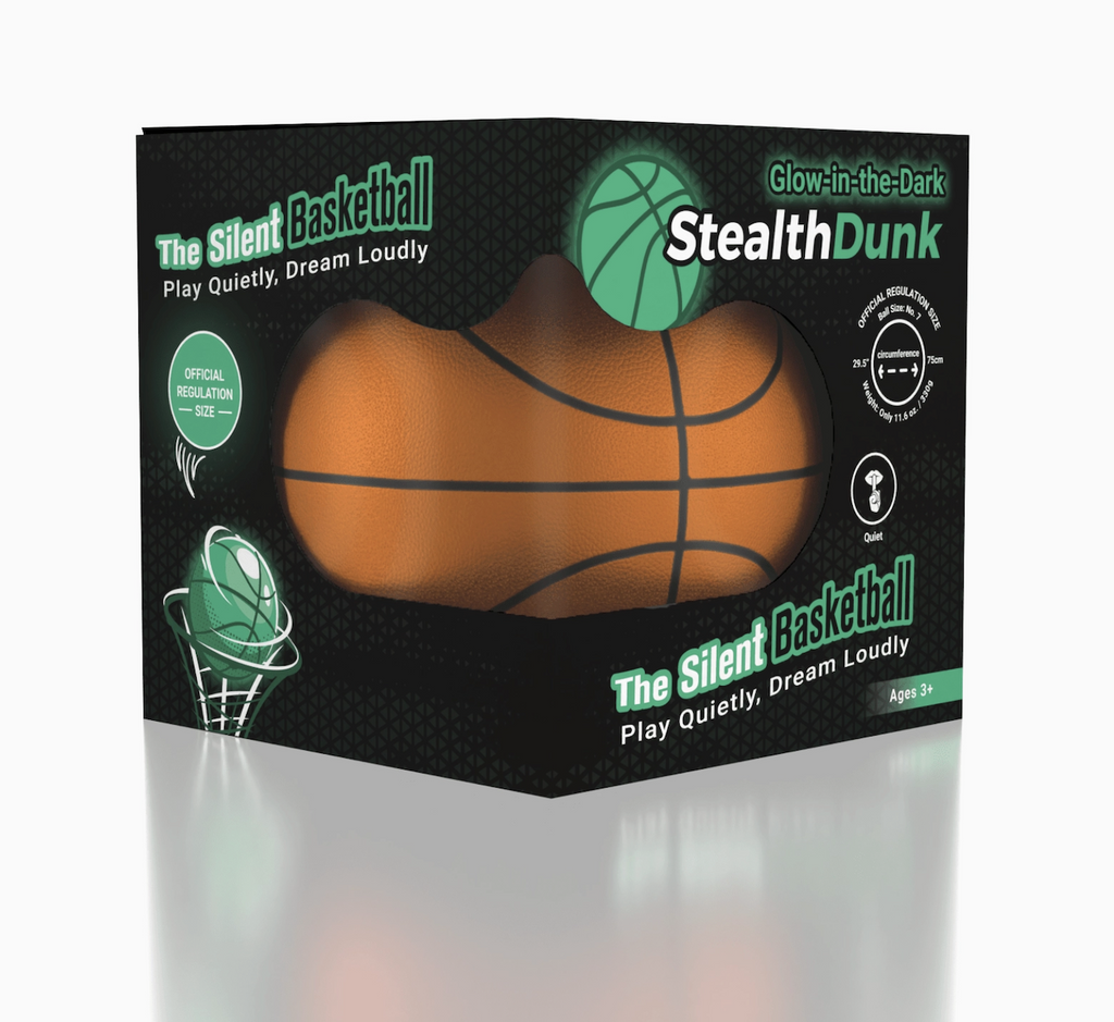 The StealthDunk Silent Basketball packaged in an open black box with graphics that show that the ball glows in the dark. The open ides allows the soft foam material that makes it silent be felt. 