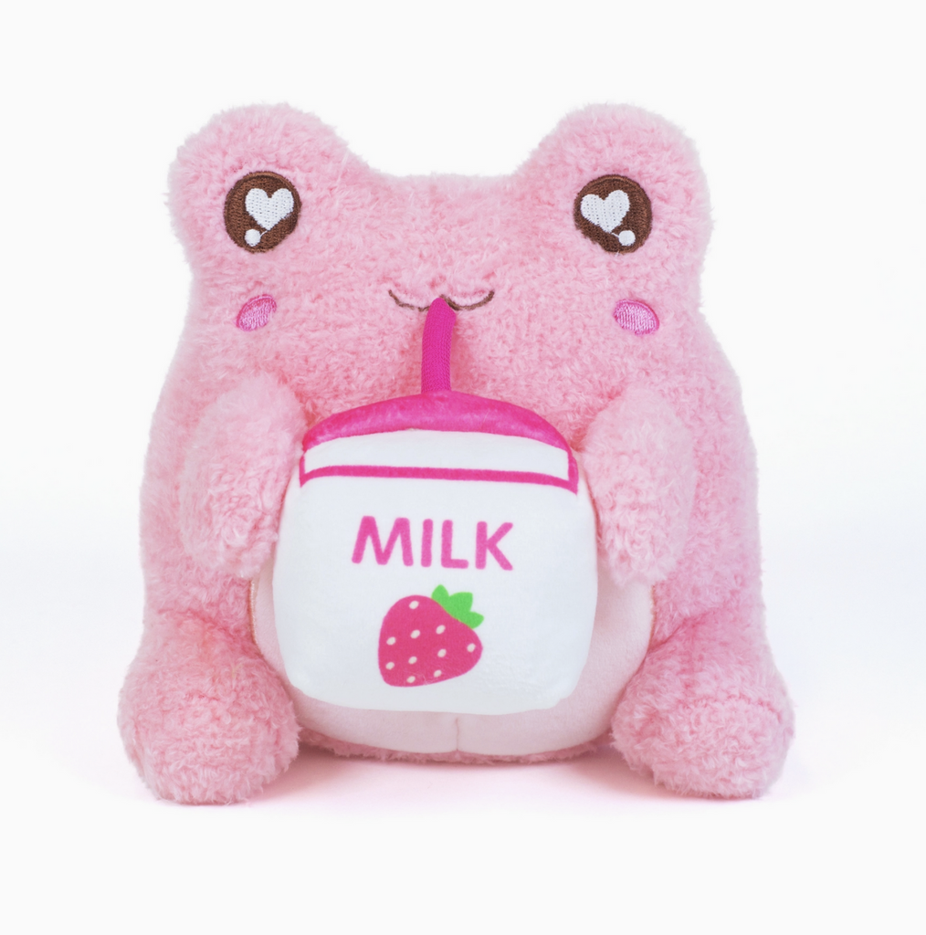Plush Strawberry Milk Sippin' Wawa plush frog who is pink and holding a carton of strawberry milk that they're srinking from. 