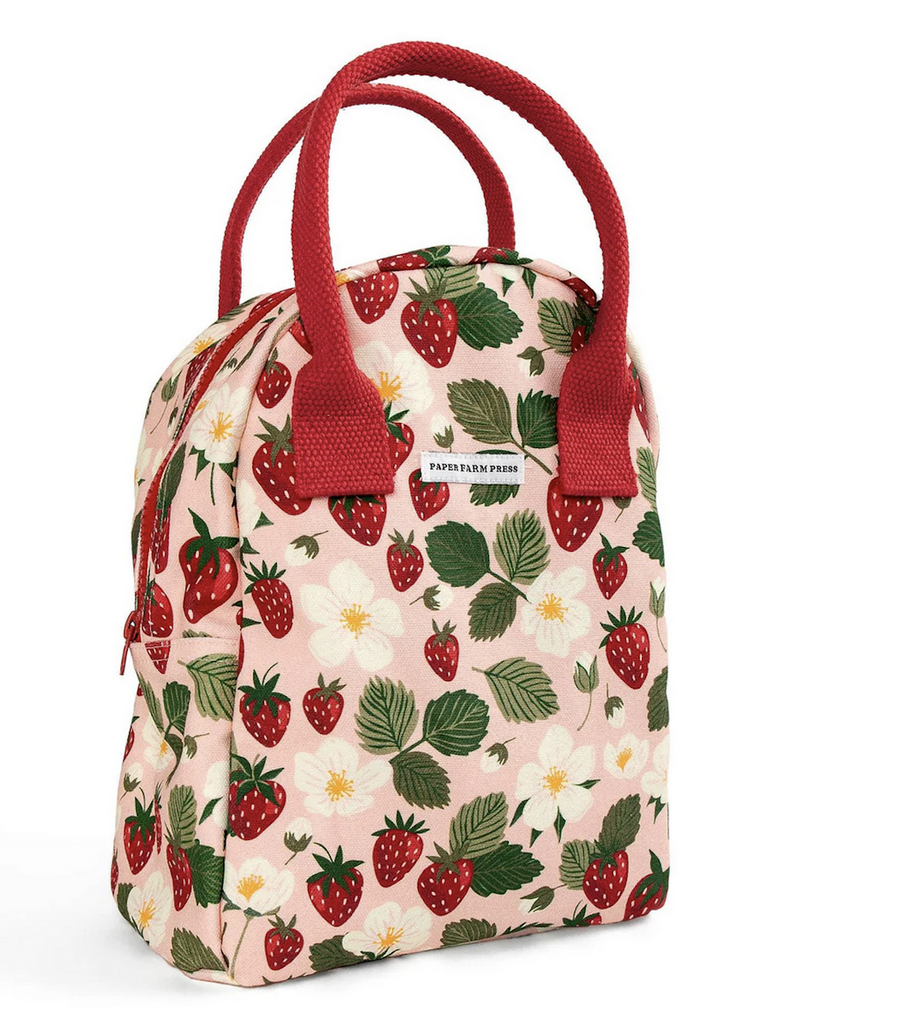 Lunch bag decorated with ripe, strawberries and pretty white blossoms with red handles and zipper closure. 
